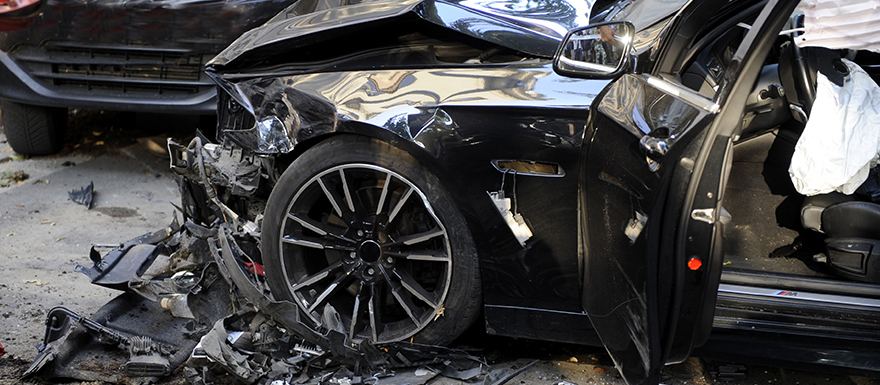 Damaged car with airbags deployed from car accident